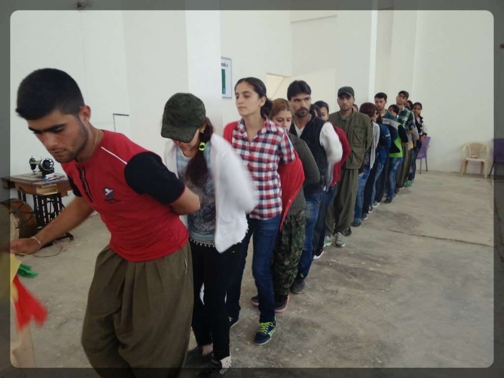 Students and teachers in Rojava learn new Kurdish dance techniques
